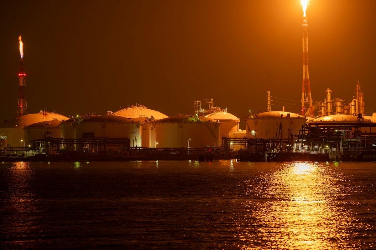 Oil refinery lit up at night
