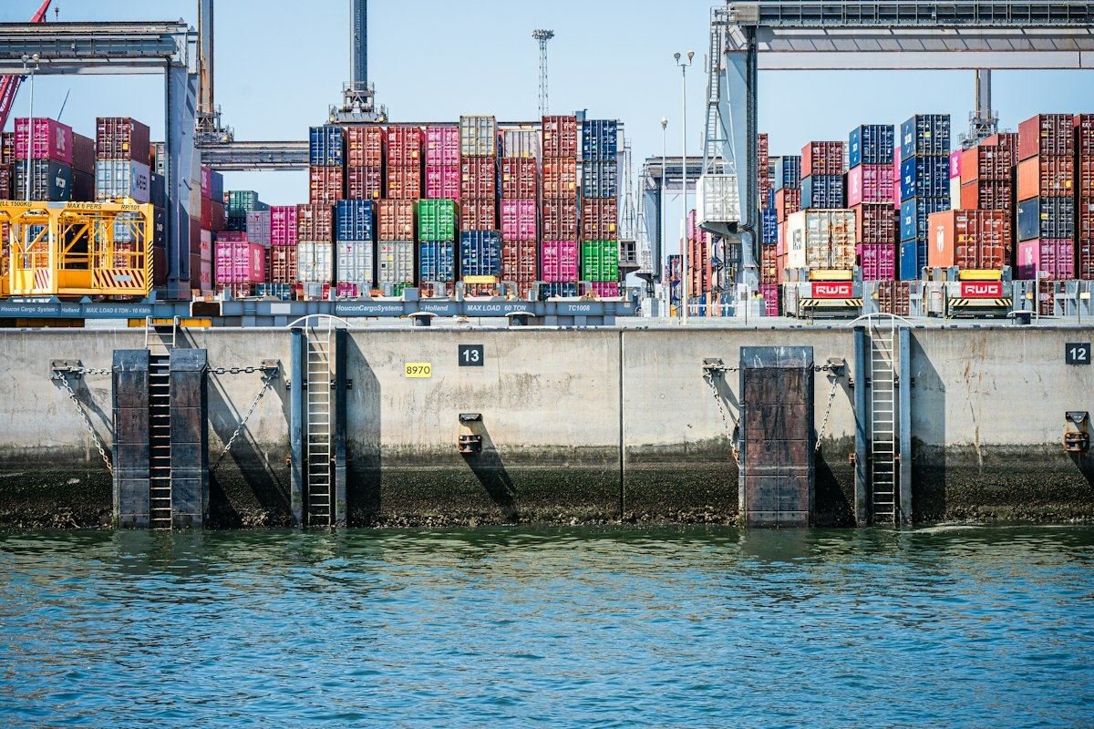 Shipping containers stacked on a dock at a commercial port