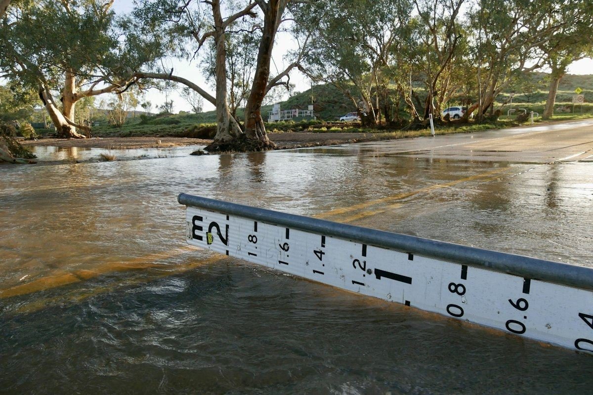 A water level gauge in a flooded creek