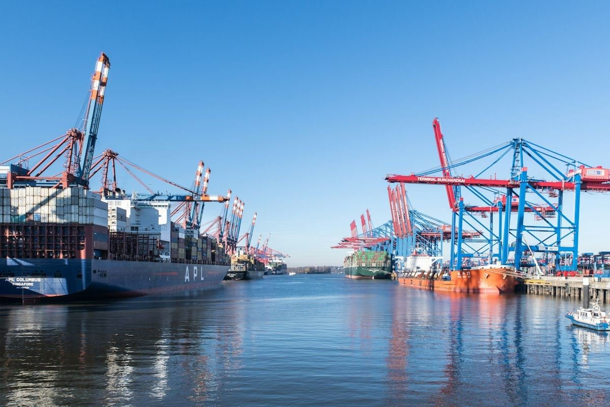 Container ships and cranes at a busy port